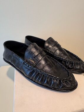 SAINT LAURENT
Le Loafer embellished collapsible-heel glossed-eel loafers
